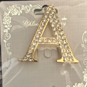 Elegant rhinestone letter “A” brooch Gold  tone